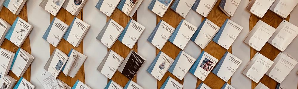 Dissertations hanging on a wall